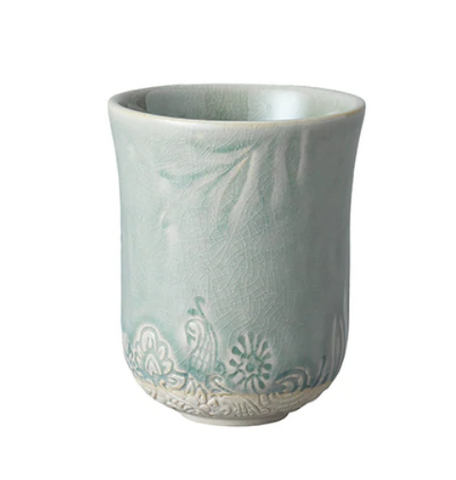 Sthal latte cup with candle.